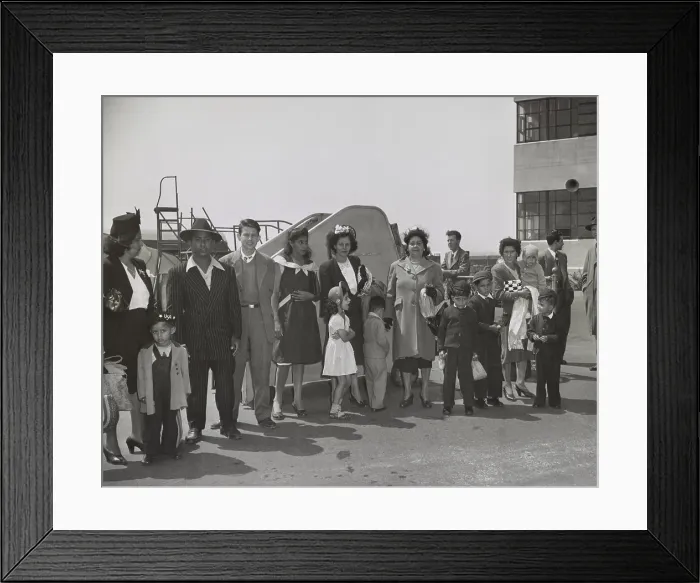 Framed Print : Group of Puerto Ricans, at Newark airport, April 29, 1947. They just arrived from Puerto Rico and are waiting to be transported to New York. April 29, 1947. (BSLOC_2014_13_133)