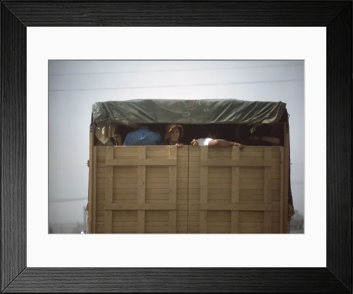 Framed Print : Migrant agricultural workers taking shelter in a truck during a dust storm, May 1972. Four corners region of Utah. Photo for EPA by Terry Eller. (BSLOC_2014_13_136)