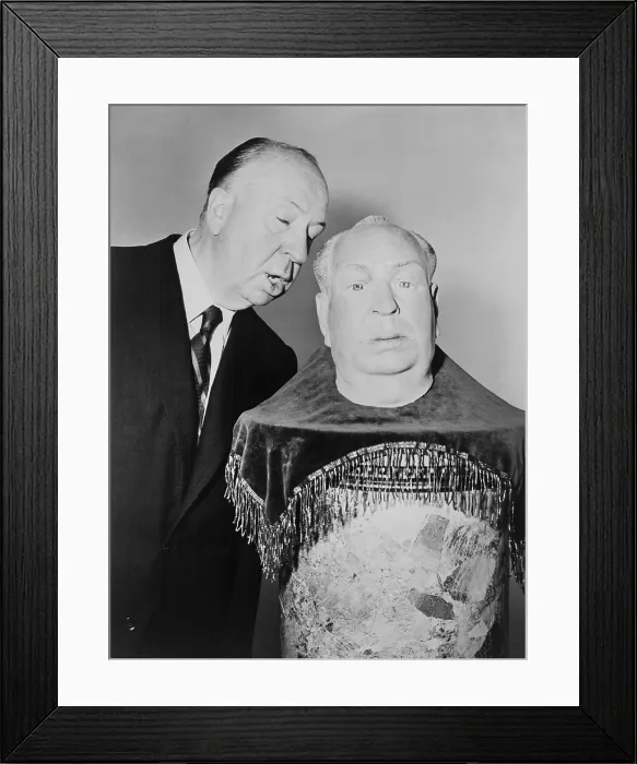 Framed Print : Alfred Hitchcock whispering into the ear of a plaster sculpture of his head Framed Print : Alfred Hitchcock whispering into the ear of a plaster sculpture of his head