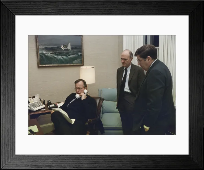Framed Print : President George Bush in a telephone conference regarding the Panama invasion on Dec. 20 1989. With him in the Oval Office Study are Gen. Brent Scowcroft and John Sununu Framed Print : President George Bush in a telephone conference regarding the Panama invasion on Dec. 20 1989. With him in the Oval Office Study are Gen. Brent Scowcroft and John Sununu