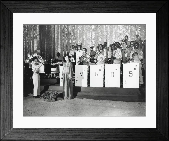 Framed Print : Josephine Baker, sings in the Municipal Theater, Oran, Algeria, North Africa. She is accompanied by a uniformed Army orchestra of African Americans. (BSLOC_2013_14_253) Framed Print : Josephine Baker, sings in the Municipal Theater, Oran, Algeria, North Africa. She is accompanied by a uniformed Army orchestra of African Americans. (BSLOC_2013_14_253)