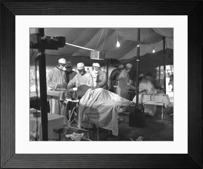 Framed Print : U.S. Navy doctors and corpsmen operate on two wounded Marines on Cape Gloucester. The tented operating room was set up in a mobile army surgical hospital (MASH). Dec