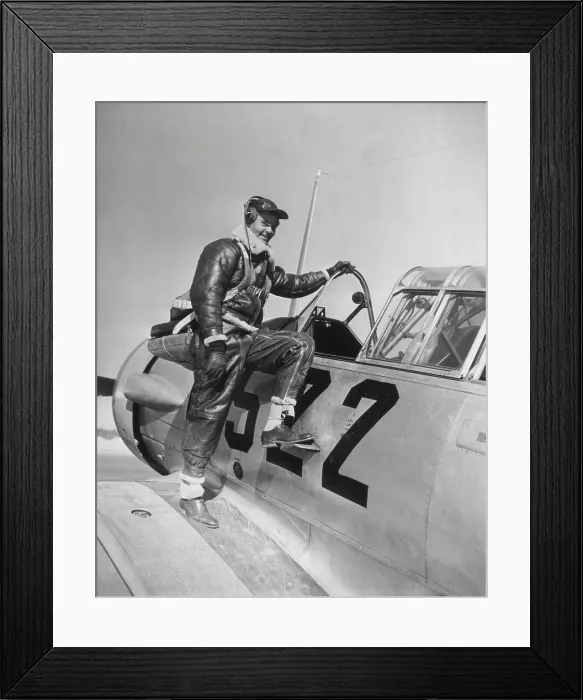 Framed Print : Capt. Benjamin Oliver Davis, Jr. climbing into a Advanced Trainer at Tuskegee, Alabama. January 1942. World War 2. (BSLOC_2013_14_245)
