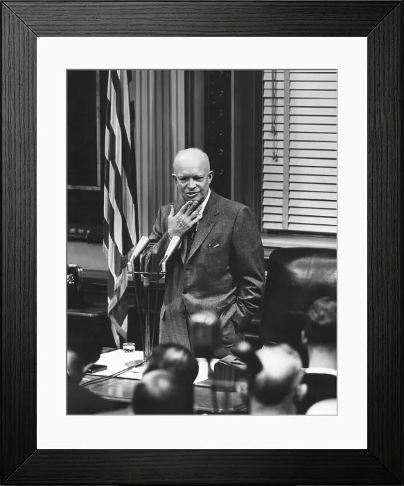 Framed Print : President Eisenhower listening to a reporter's question at a press conference. Feb. 23, 1955. - (BSLOC_2014_16_70)