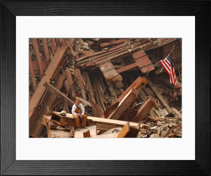 Framed Print : Solo firefighter sitting on a beam in the wreckage of the World Trade Center, Sept. 28, 2001. New York City, after September 11, 2001 terrorist attacks. (BSLOC_2015_2_109)