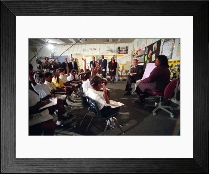 Framed Print : On the morning of the 9-11 Terrorist Attacks, President Bush was in a classroom in Sarasota, FL. Photo shows him observing a reading demonstration, at Emma E Framed Print : On the morning of the 9-11 Terrorist Attacks, President Bush was in a classroom in Sarasota, FL. Photo shows him observing a reading demonstration, at Emma E
