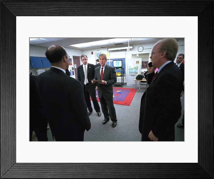 Framed Print : President George W. Bush with senior staff after learning of the 9-11 Terrorist Attacks. He is still at Emma E. Booker Elementary School in Sarasota, FL