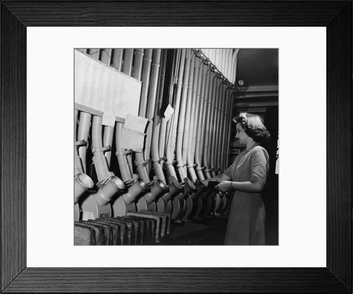 Framed Print : Washington D.C. bank worker Helen Ringwald sends messages to other bank branches of the city through pneumatic tubes. June 1943. (BSLOC_2010_18_94)