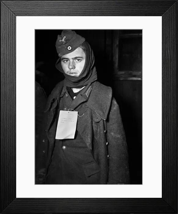 Framed Print : POW captured near Ubach, Germany, wears a tag indicating he has an sprained back. Dec. 1, 1944 during World War 2. (BSLOC_2013_14_290) Framed Print : POW captured near Ubach, Germany, wears a tag indicating he has an sprained back. Dec. 1, 1944 during World War 2. (BSLOC_2013_14_290)