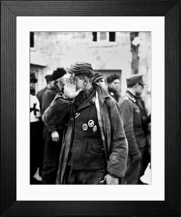 Framed Print : German prisoner captured during the Battle of the Bulge declines to be photographed. He was captured by the U.S. 16th Infantry Regiment, near Weywertz, Belgium. Jan