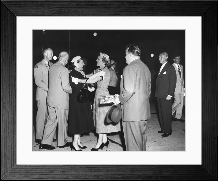 Framed Print : Pat Nixon embraces Mamie Eisenhower at National Airport. July 15, 1955