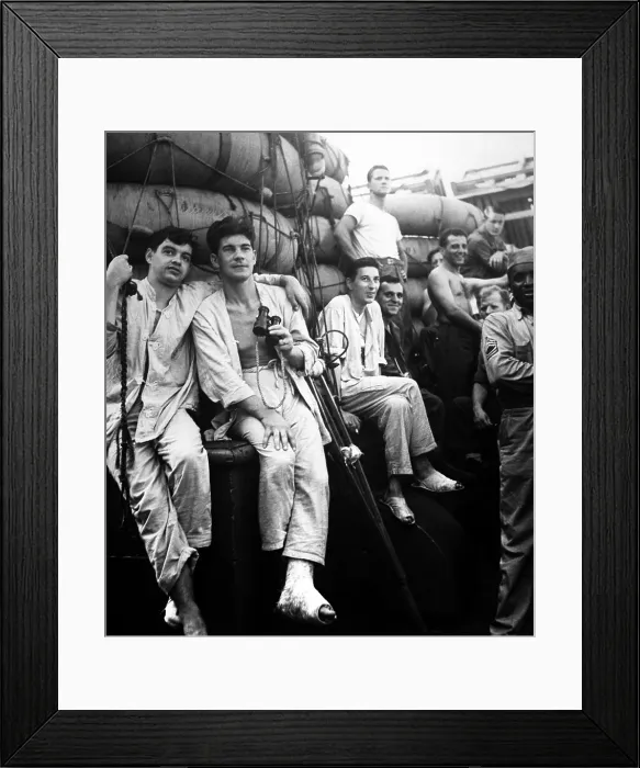 Framed Print : U.S. soldiers have the first glimpse of home from a troopship in July 1944, during World War 2. The group includes wounded men who left their beds to make sure it was true