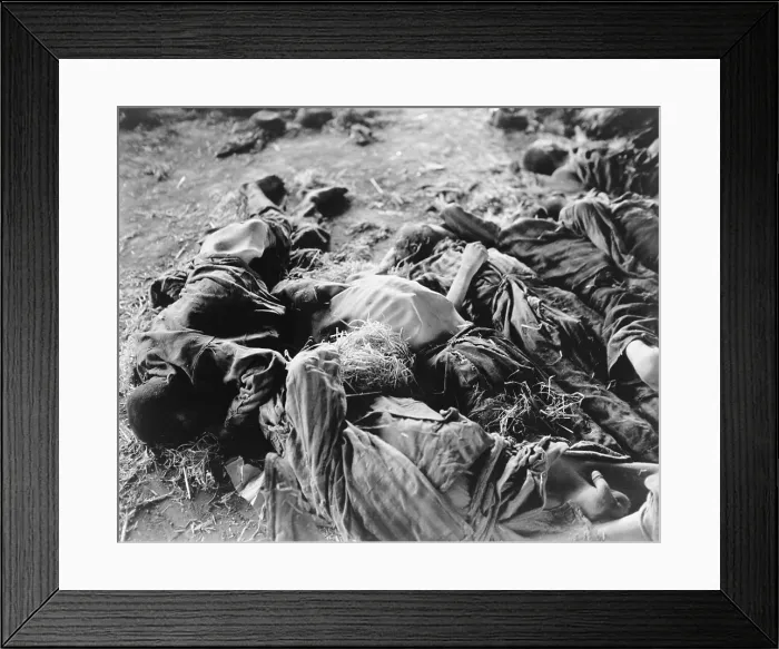 Framed Print : Bodies of German slaves lie where they died of starvation on prison floors of a concentration camp in Nordhausen, Germany after liberation by First U.S. Army on April 11, 1945 Framed Print : Bodies of German slaves lie where they died of starvation on prison floors of a concentration camp in Nordhausen, Germany after liberation by First U.S. Army on April 11, 1945