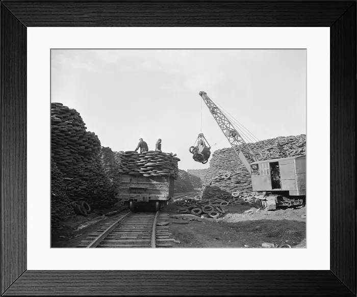 Framed Print : Massive Firestone rubber reclamation facility with millions of discarded tire and inner tubes covering over 100 acres. December 1941