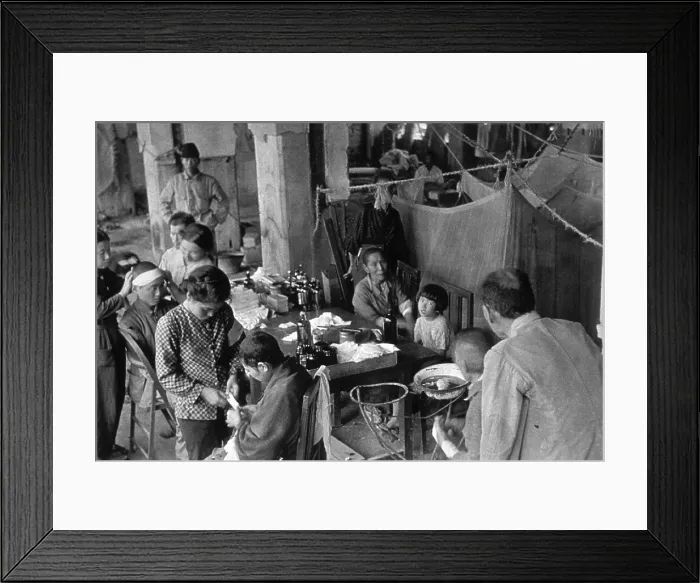 Framed Print : Victims of the Nagasaki atomic bombing of August 9, 1945 seek medical treatment in the Fukuromachi Relief Station. Outpatients are in the foreground