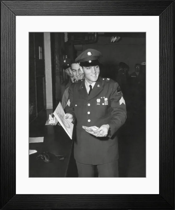 Framed Print : Sgt. Elvis A. Presley, 32nd Armored, 3rd Armored Div. collecting his last pay as he re-enters civilian life. March 5, 1960. - (BSLOC_2014_17_108)
