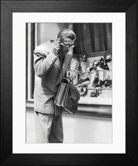 Framed Print : The Telephonogramme in use of the streets of Paris, May 10, 1950. This was an early wireless mobile telephone that could fit into a briefcase. - (BSLOC_2014_17_110) Framed Print : The Telephonogramme in use of the streets of Paris, May 10, 1950. This was an early wireless mobile telephone that could fit into a briefcase. - (BSLOC_2014_17_110)