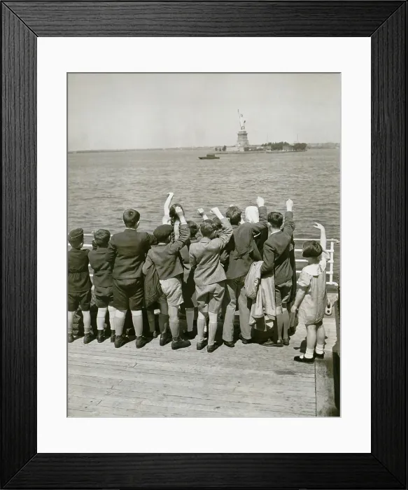 Framed Print : Jewish refugee children waving at the Statue of Liberty from the deck of the liner President Harding in 1939