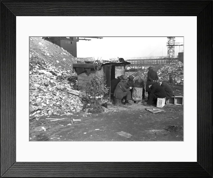 Framed Print : Hooverville at East 12th Street, New York City. Unemployed workers sit on crates by a shack with Christmas tree. January 1938 photo by Russell Lee