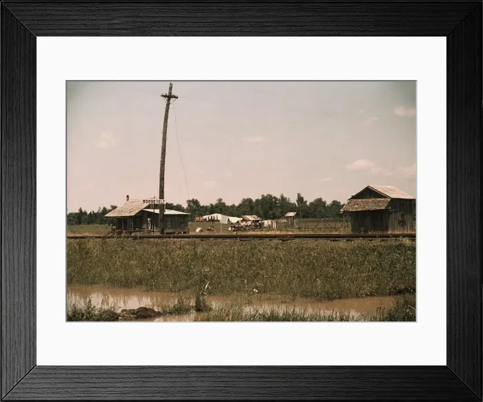 Framed Print : Small Southern farmstead along the Railroad tracks displays a ROOSEVELT sign. A wire travels from the utility pole to the home, perhaps providing electricity