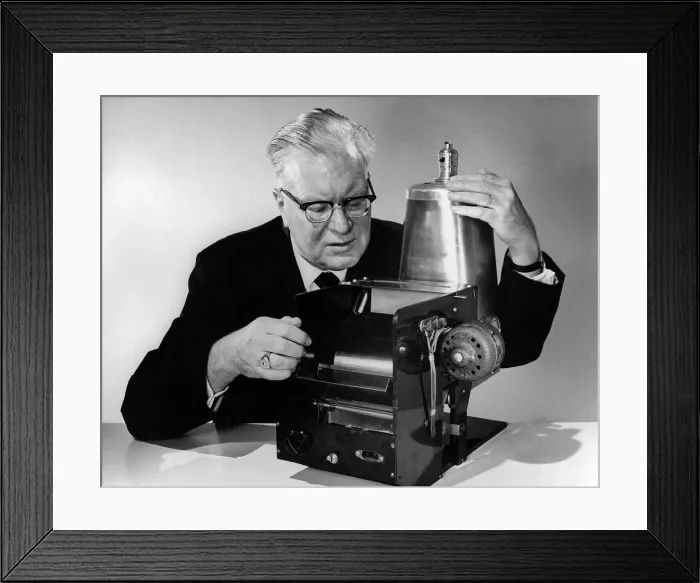 Framed Print : Chester Carlson 1906-1968 with the first model of his invention of 1938 that evolved over 20 years into the Xerox copier. Ca. 1960. (BSLOC_2010_18_180)