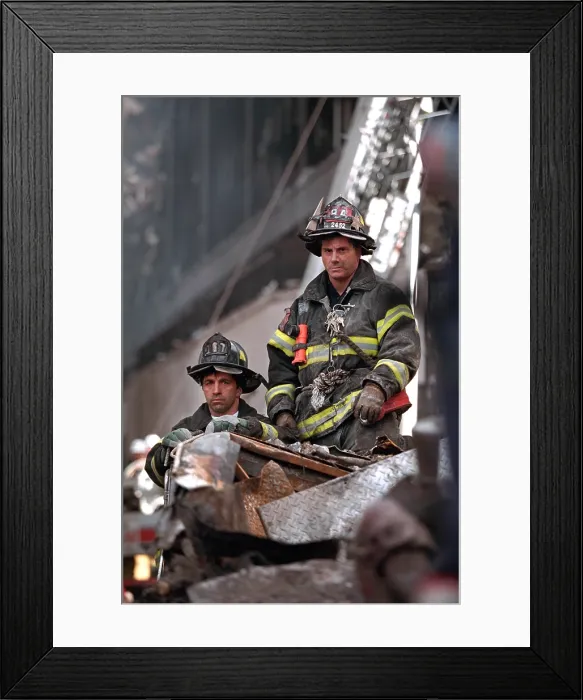 Framed Print : NYC Firemen, grim and geared for rescue / recovery work at the destroyed World Trade Center, NYC. They have a high seat to view President George W
