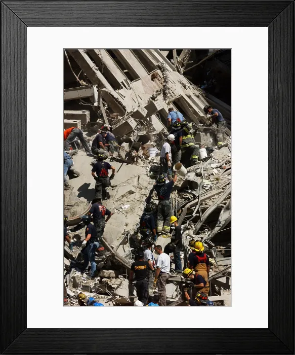 Framed Print : A bucket brigade works to carefully clear debris of the World Trade Center, Sept. 14, 2001
