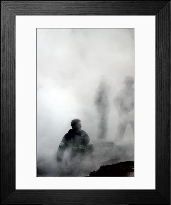 Framed Print : NYC Fireman emerges from the smoke and debris of the World Trade Center on Sept. 14, 2001. New York City, after September 11, 2001 terrorist attacks. U.S