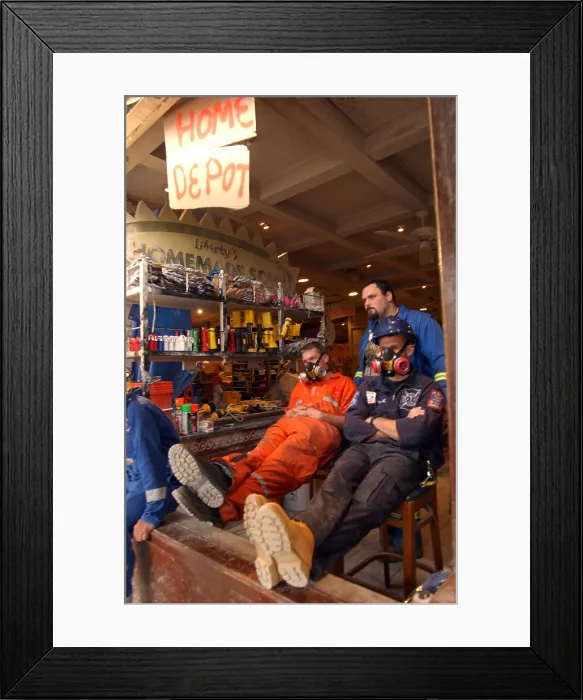 Framed Print : Emergency workers taking a rest near the World Trade Center, Sept. 16, 2001. New York City, after September 11, 2001 terrorist attacks. (BSLOC_2015_2_88)