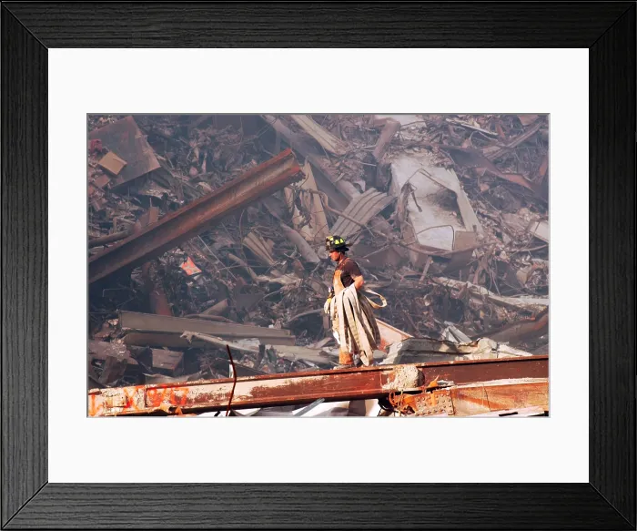 Framed Print : NYC Fire fighter carries a fire hose over smouldering fires and wreckage at Ground Zero, Sept. 18, 2001 Framed Print : NYC Fire fighter carries a fire hose over smouldering fires and wreckage at Ground Zero, Sept. 18, 2001