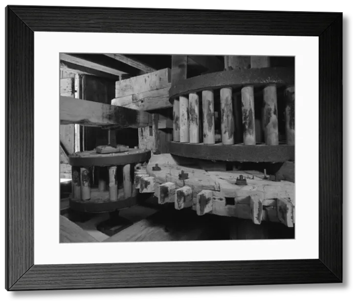 Framed Print : Wooden gears inside an old tide mill. The Great spur wheel and wallower on left, Auxiliary pinon on right. Lefferts Tide Mill was built in 1793 in Huntington, New York State Framed Print : Wooden gears inside an old tide mill. The Great spur wheel and wallower on left, Auxiliary pinon on right. Lefferts Tide Mill was built in 1793 in Huntington, New York State