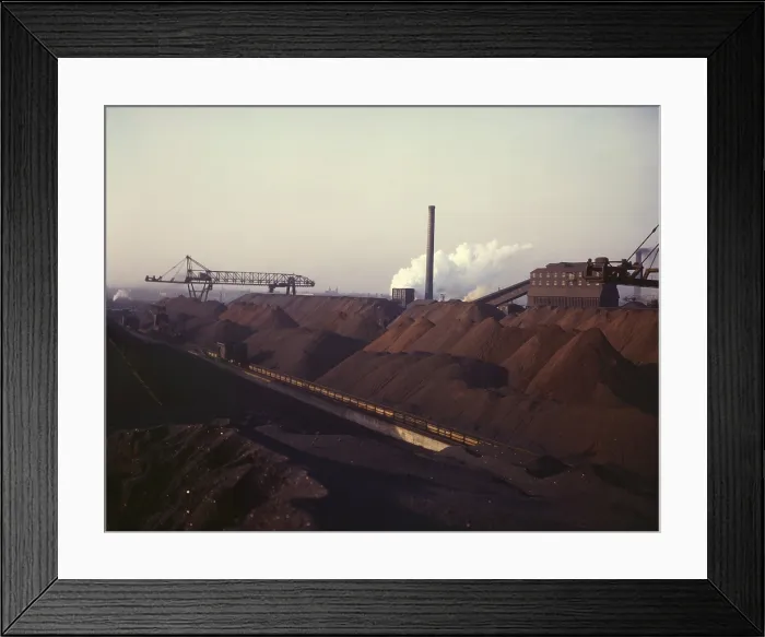 Framed Print : Massive stock pile of coal and iron ore, at the Hanna furnaces of the Great Lakes Steel Corporation in Detroit, Michigan. 1942