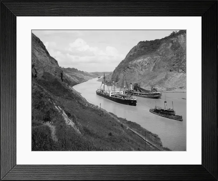Framed Print : Boats move through Panama Canal at the Culebra Cut (Gaillard Cut), which crosses the continental divide. At center right is a suction dredge to maintain canal depth. Ca. 1910-14 Framed Print : Boats move through Panama Canal at the Culebra Cut (Gaillard Cut), which crosses the continental divide. At center right is a suction dredge to maintain canal depth. Ca. 1910-14