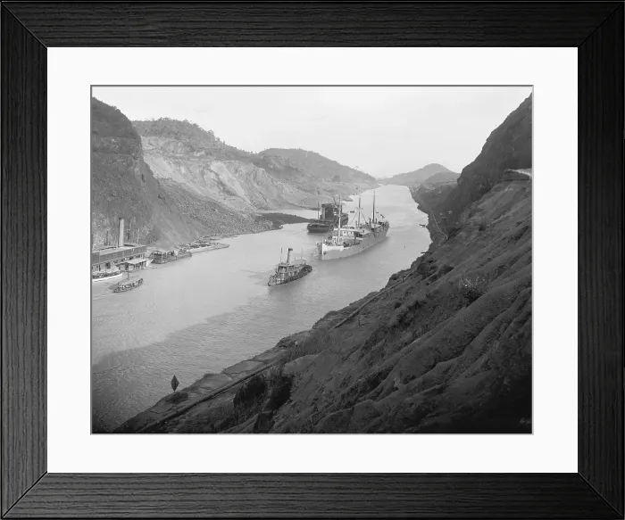 Framed Print : Boats move through Panama Canal at the Culebra Cut (Gaillard Cut), which crosses the continental divide. Ca. 1915 Framed Print : Boats move through Panama Canal at the Culebra Cut (Gaillard Cut), which crosses the continental divide. Ca. 1915
