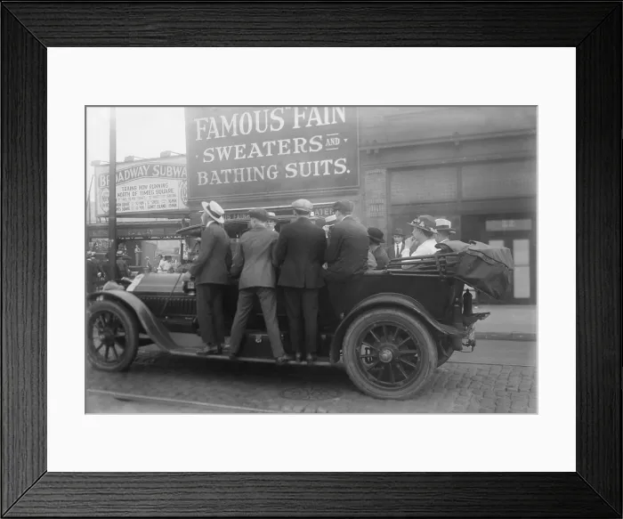 Framed Print : Men ride on the running boards of a improvised mass transit vehicle during a strike in Brooklyn, ca. 1915