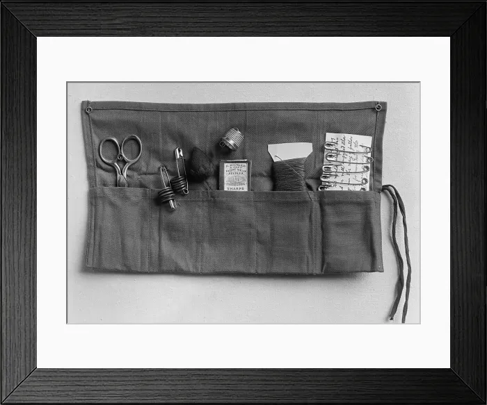 Framed Print : A simple sewing kit, provided to sailors by the Navy League of the U.S. Ca. 1905-1940 Framed Print : A simple sewing kit, provided to sailors by the Navy League of the U.S. Ca. 1905-1940