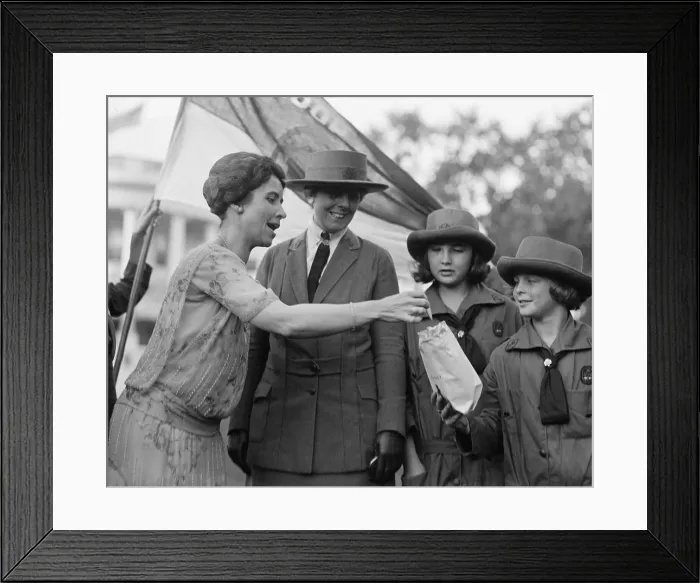 Framed Print : First Lady Grace Coolidge enthusiastically samples Girl Scout Cookies. October 17, 1923. (BSLOC_2015_16_41)
