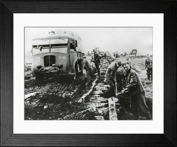 Framed Print : German army fights the autumn mud to supply the army in Stalingrad in Oct. 1942. Roadbuilders have laid logs to create a road bed, but it is still incomplete and unstable