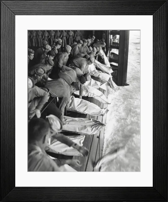 Framed Print : Burial at sea for the officers and men of the USS Intrepid during World War 2. They were killed when the carrier was hit by Japanese bombs during operations in the Philippines