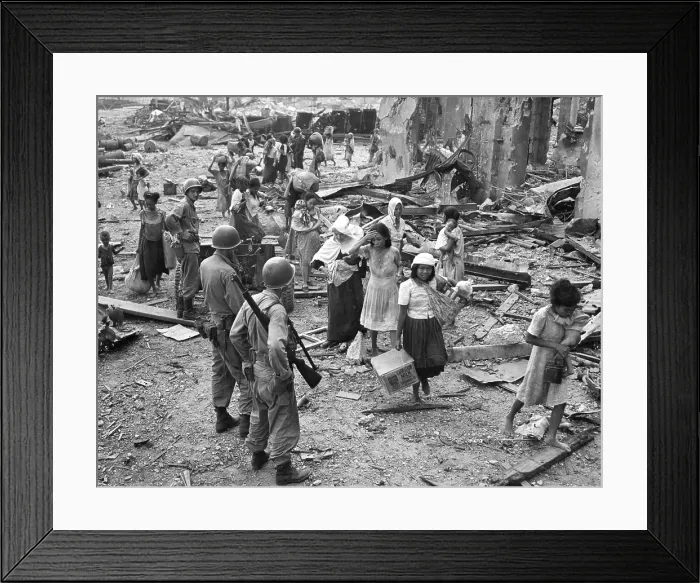 Framed Print : Women and children picking their way barefooted over the wreckage of North Manila, ca. Feb. 23, 1945