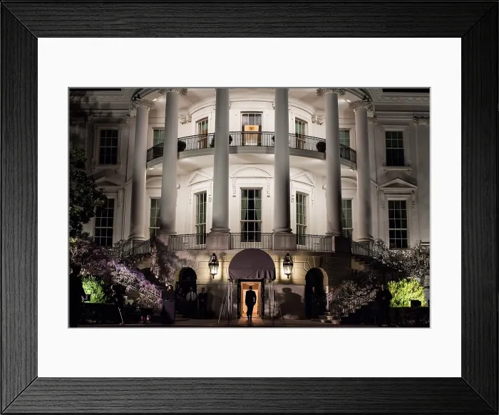 Framed Print : President Barack Obama enters the South Portico of the White House at night on March 30, 2012. (BSLOC_2015_13_131)