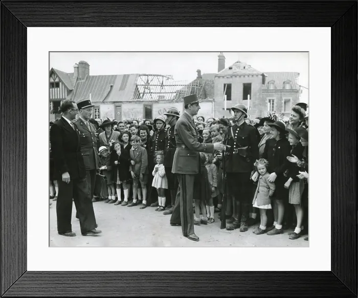 Framed Print : General Charles De Gaulle in Normandy, June 11, 1945. In the background are bombed out buildings. De Gaulle was Chairman of the Provisional Government of the French Republic