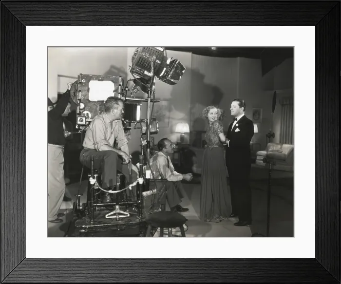 Framed Print : Camera man Don Clark and Director James Tinling film a scene for Change of Heart with Lyle Talbot and Gloria Stuart. 20th Century Fox. Ca. 1938. - (BSLOC_2014_17_123)