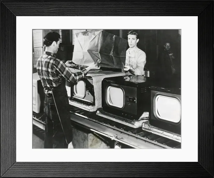 Framed Print : At the end of the assembly line, inspected televisions are packaged in an American factory. July 1949. - (BSLOC_2014_17_138)