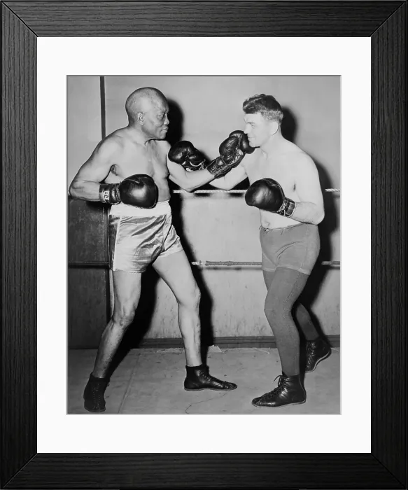 Framed Print : Former heavyweight champion, Jack Johnson, left, in fighting pose with Steve Dudos. 1945. Johnson was then 68 years old and died the following year. - (BSLOC_2014_17_143)