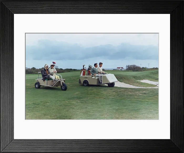 Framed Print : The Kennedys golf with the Ben Bradlees at the Newport Country Club. Antoinette Bradlee and Jacqueline Kennedy follow the golf cart of the President and Journalist Benn Bradlee Framed Print : The Kennedys golf with the Ben Bradlees at the Newport Country Club. Antoinette Bradlee and Jacqueline Kennedy follow the golf cart of the President and Journalist Benn Bradlee