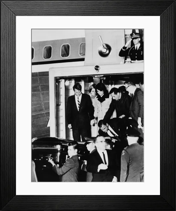 Framed Print : John Kennedy's Coffin. Robert Kennedy holds Jacqueline Kennedy's hand as they watch the body of the assassinated President removed from Air Force One to an ambulance Framed Print : John Kennedy's Coffin. Robert Kennedy holds Jacqueline Kennedy's hand as they watch the body of the assassinated President removed from Air Force One to an ambulance