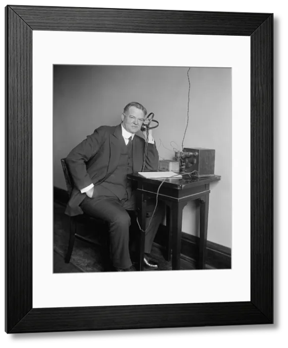 Framed Print : Herbert Hoover, Secretary of Commerce, listening to a radio on Dec. 31, 1924. (BSLOC_2015_16_51)