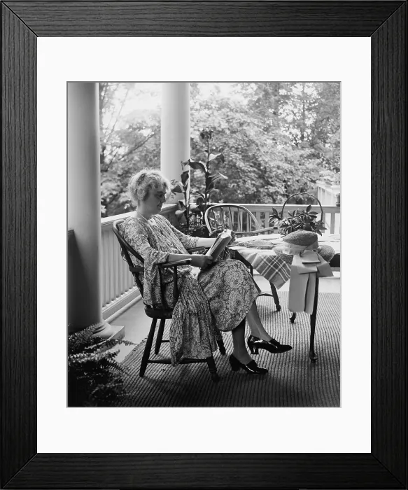 Framed Print : Lou Henry Hoover, future First Lady, reading on her porch in 1926. She was highly educated and a skilled linguist. (BSLOC_2015_16_57)