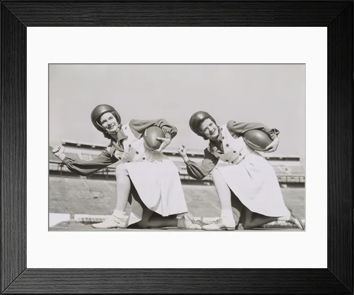 Framed Print : Two cheerleaders from Tulane University, Oct. 5, 1942. They are wearing football helmets and holding footballs. - (BSLOC_2014_17_175) Framed Print : Two cheerleaders from Tulane University, Oct. 5, 1942. They are wearing football helmets and holding footballs. - (BSLOC_2014_17_175)